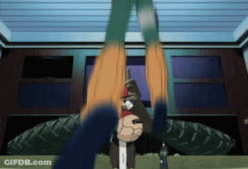 Cartoon Character Hanging Upside Down In Front Of Tire GIF