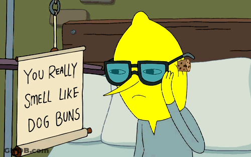 Cartoon Character Holding Cookie And Sign Saying You Smell Like Dog Buns GIF