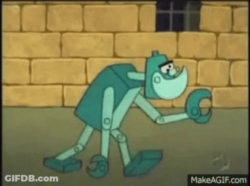 Cartoon Character Holding Glove In Front Of Brick Wall GIF