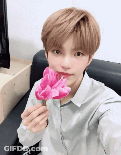 Cartoon Character Holding Pink Book On Chair GIF