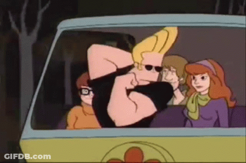 Cartoon Character In Black Shirt And Blue Jeans Pointing GIF