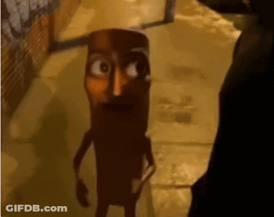 Cartoon Character In Dark Alleyway Looking At Man GIF