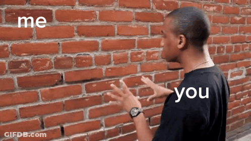 Cartoon Character In Front Of Brick Wall GIF