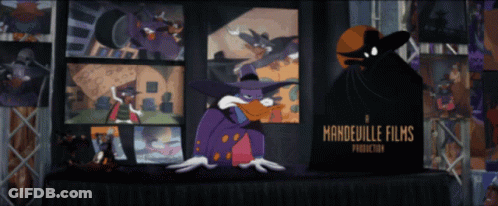 Cartoon Character In Front Of Mandelville Films Sign GIF