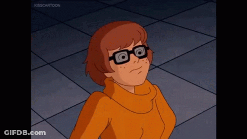 Cartoon Character In Glasses And Orange Sweater Looking Up GIF