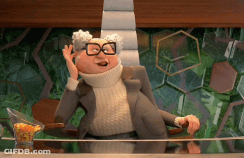 Cartoon Character In Glasses And Turtleneck Sitting GIF