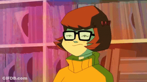 Cartoon Character In Glasses And Yellow Sweater GIF