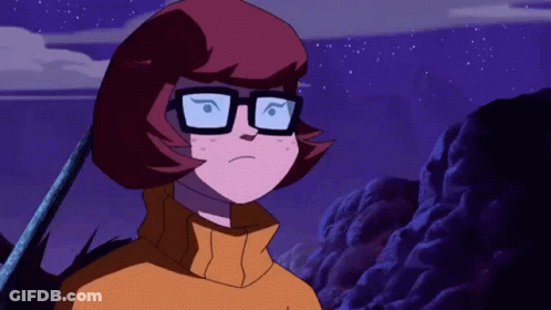 Cartoon Character In Glasses And Yellow Sweater Under Purple Sky GIF