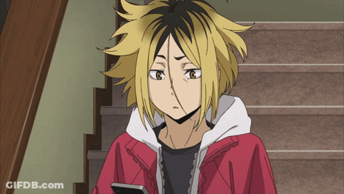 Cartoon Character In Red Jacket And Yellow Hair Looking At Phone GIF