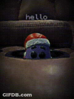 Cartoon Character In Santa Hat Peeking From Box GIF
