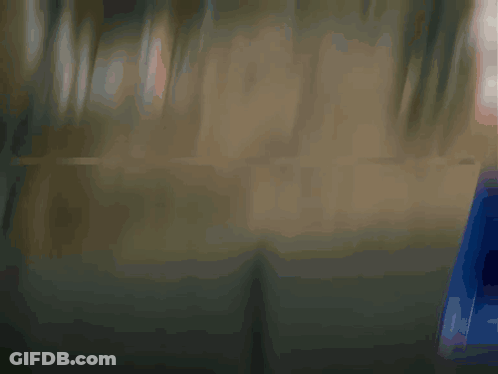 Cartoon Character In Suit Adjusting Tie GIF