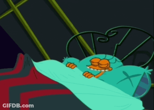Cartoon Character Laying In Bed With Cross Pillow GIF