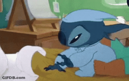 Cartoon Character Laying On Bed In Sleep Cap GIF