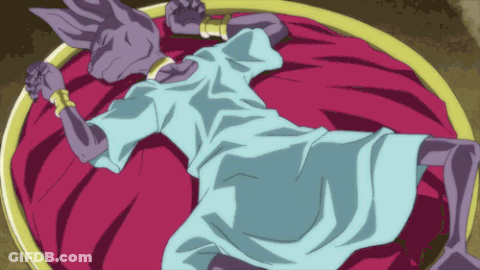 Cartoon Character Laying On Bed With Purple Blanket GIF