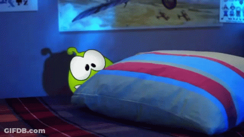 Cartoon Character Laying On Bed With Striped Pillow GIF