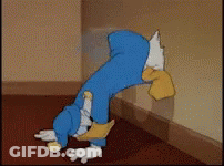 Cartoon Character Leaning Against Wall With Head In Hole GIF