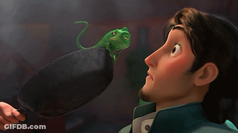 Cartoon Character Looking At Green Lizard On Pan GIF