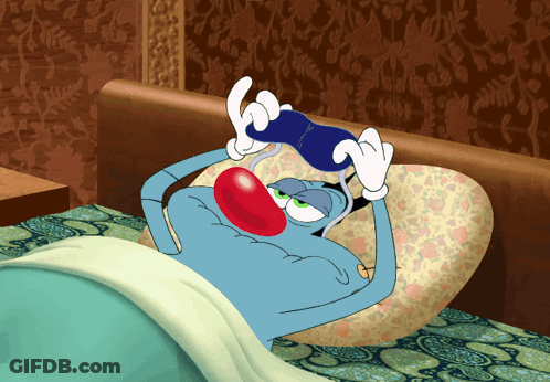 Cartoon Character Lying In Bed Holding Blue Object GIF