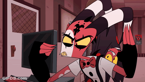 Cartoon Character Making Funny Face At Computer GIF