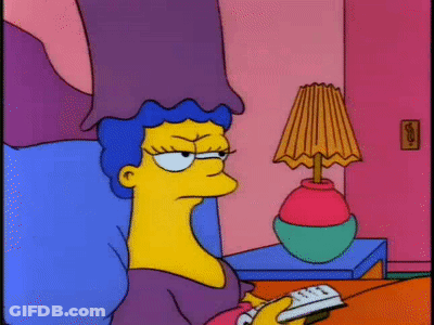 Cartoon Character On Bed With Remote And Lamp GIF