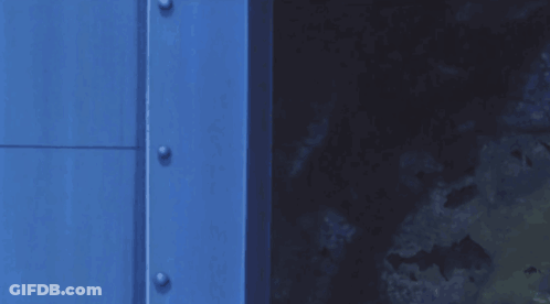 Cartoon Character Peeking Out Of Blue Door GIF