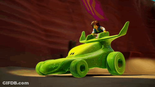 Cartoon Character Riding Green Vehicle GIF