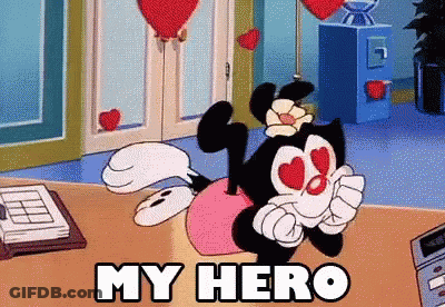 Cartoon Character Saying My Hero Sitting On Table GIF