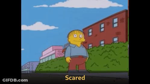Cartoon Character Scared In Front Of Building GIF