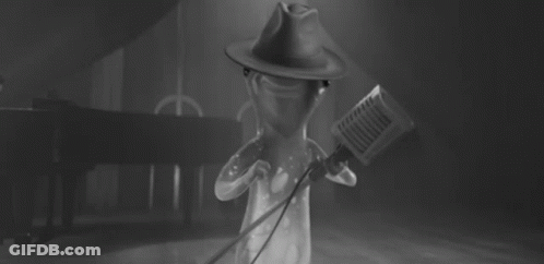 Cartoon Character Singing Into Microphone With Hat GIF