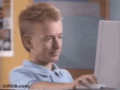 Cartoon Character Sitting At Computer GIF