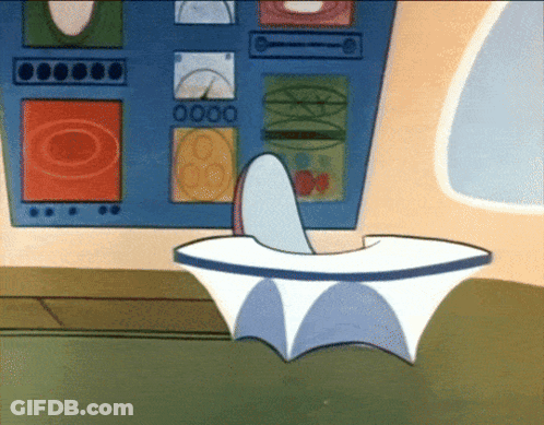 Cartoon Character Sitting At Desk With 0000 On Wall GIF