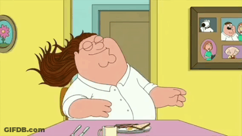 Cartoon Character Sitting At Table With Food GIF