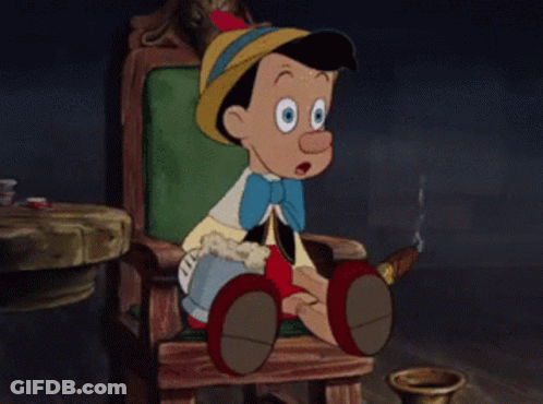 Cartoon Character Sitting In Chair Holding Mug GIF