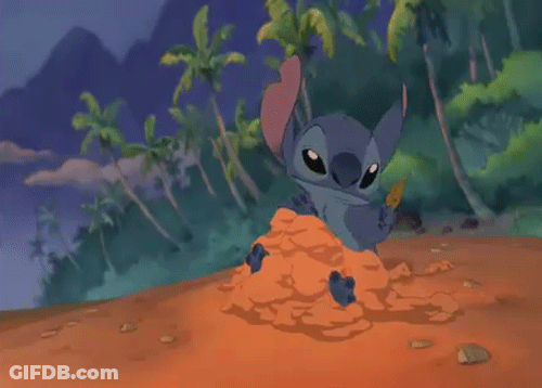 Cartoon Character Sitting In Pile Of Sand GIF