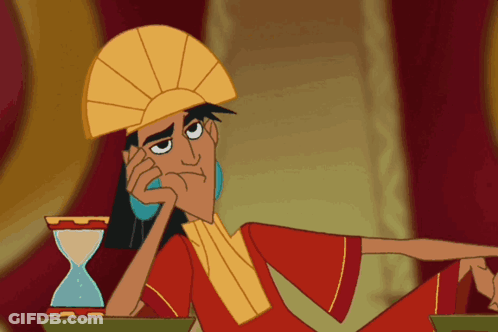 Cartoon Character Sitting Next To Hourglass GIF