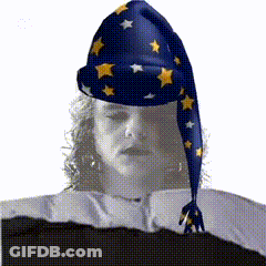 Cartoon Character Sitting On Bed Holding Cane GIF