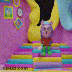 Cartoon Character Sitting On Colorful Stairs GIF