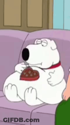 Cartoon Character Sitting On Couch Eating Heart Shaped Chocolate GIF