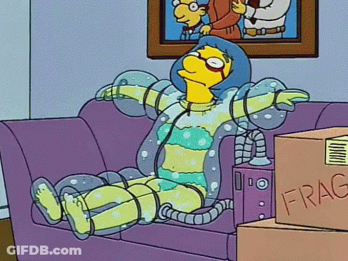 Cartoon Character Sitting On Couch Next To Fragile Box GIF