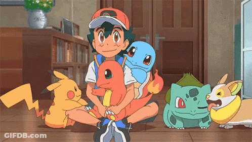 Cartoon Character Sitting On Floor Holding Pokemon GIF