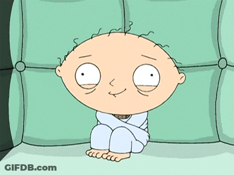 Cartoon Character Sitting On Green Couch GIF