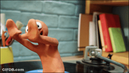 Cartoon Character Standing By Bookshelf GIF