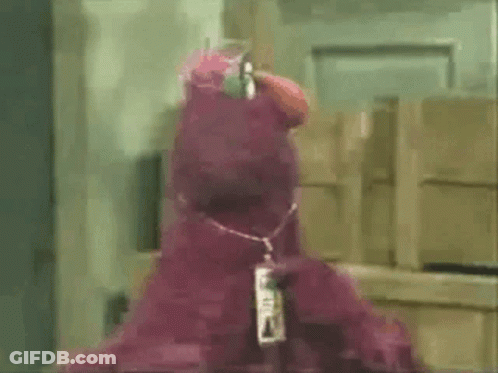 Cartoon Character Standing In Field With Arms Up GIF