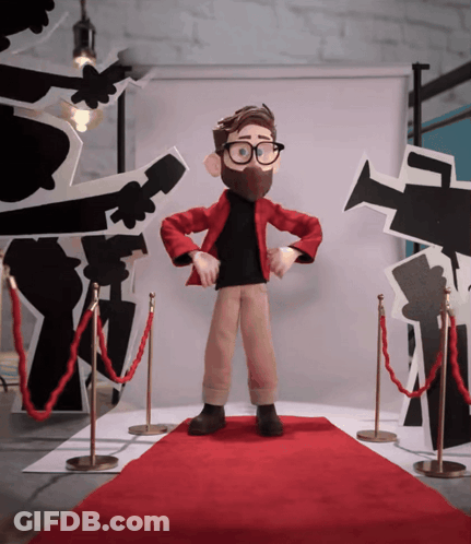 Cartoon Character Standing On Red Carpet In Front Of Cameras GIF