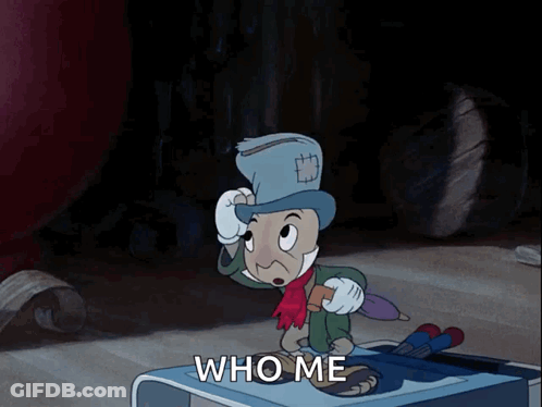 Cartoon Character Standing On Table Saying Who Me GIF