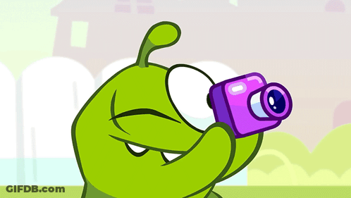 Cartoon Character Taking Picture With Pink Camera GIF