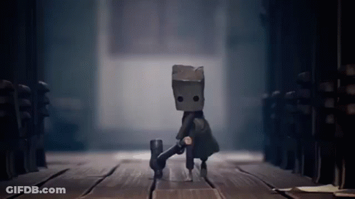 Cartoon Character Walking With Bag On Head GIF