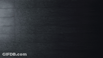 Cartoon Character With Beanie On Street At Night GIF