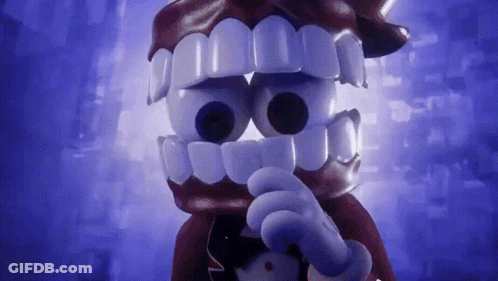 Cartoon Character With Big Teeth And Bow Tie Pointing GIF
