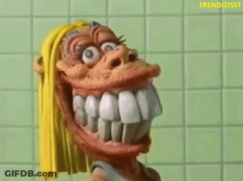 Cartoon Character With Big Teeth Holding Toothbrush GIF